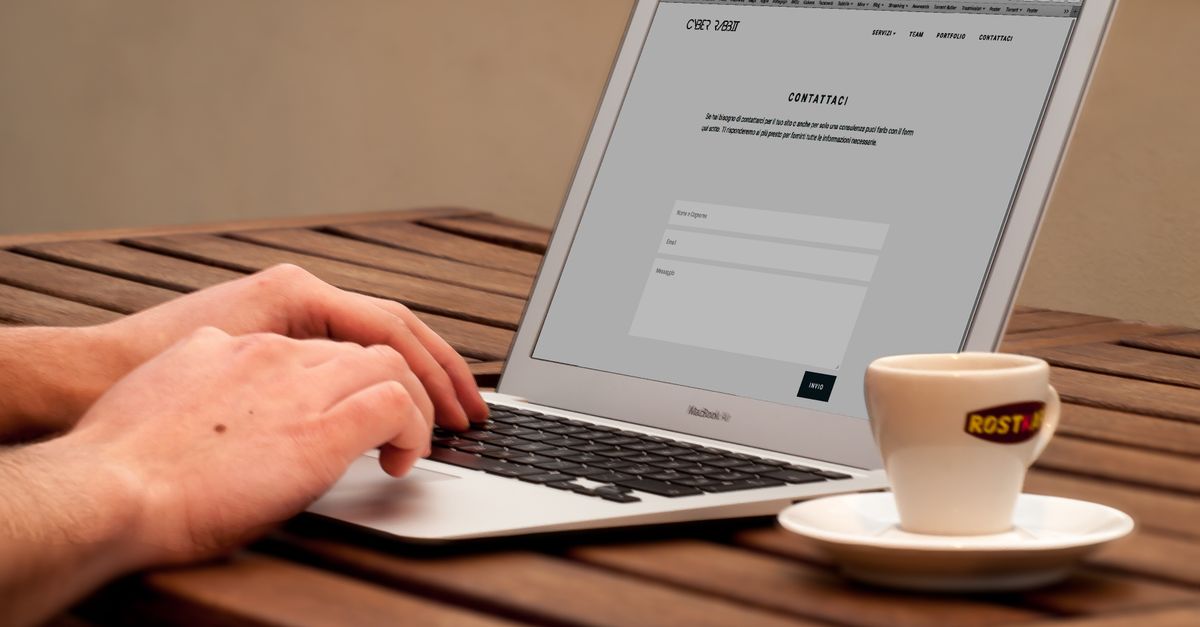 A content editor launch checklist beside a laptop.